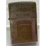 Vietnam war style zippo lighter with inscription to back.