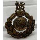 A WWII style Royal Marine Commando cap badge with hidden compass to reverse.