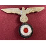 A WWII style Kriegsmarine "Donald Duck" naval hat badge (a/f).