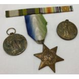3 British WWII style medals together with a ribbon bar.
