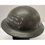 A WWII style London Transport "Brodie" helmet made from Bakelite.