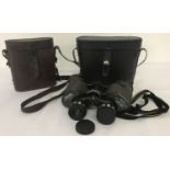 A cased pair of Miranda binoculars together with a vintage leather binoculars case.