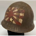 A WWII style veteran souvenir Japanese helmet from "Peleliu".