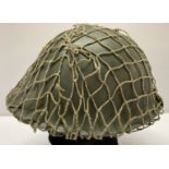 A WWII style British 1944 pattern D-Day "Turtle" helmet with can net.