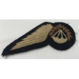 A British RAF WWII style Parachute Jump Instructor's embroidered badge.