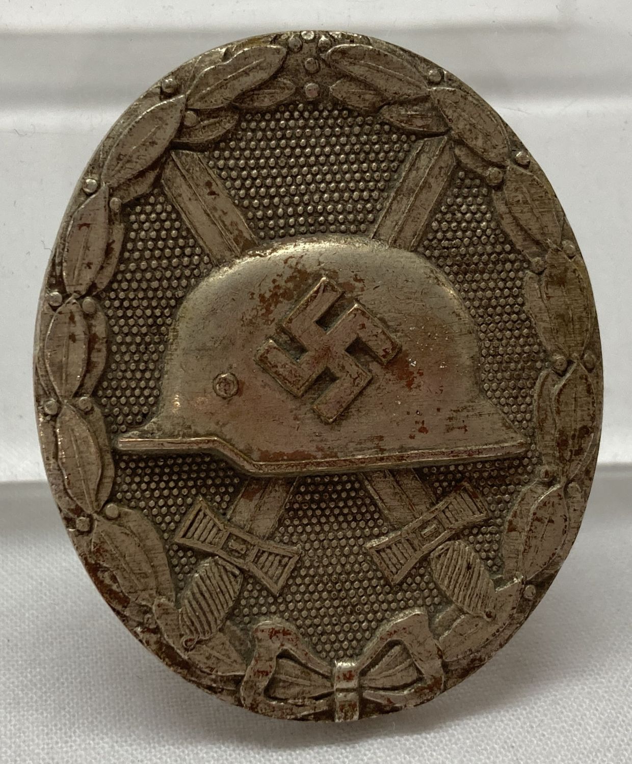 A German WWII style silver wound pin back badge, 2nd class.