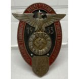 A German WWII style rally plaque with eagle motif.