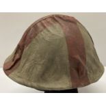 A WWII style French M26 Casque Adriane helmet with medics cloth cover.