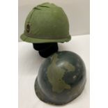 A Vietnam war interest pre 1974 US M1 supply sergeants helmet with rear split seam.