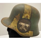WWI style Imperial German M16 machine gunners Stahlhelm helmet with painted camouflage detail.