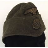 A WWII style Waffen SS M40 overseas side cap. Marked with name and date.