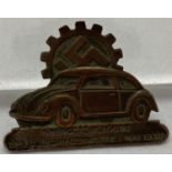 A German WWII style Volkswagen fundraising badge.