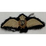A WWI style Royal Flying Corps cloth pilot's wings embroidered badge.