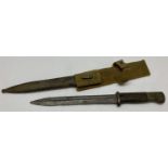 A WWII style German Africa Corps Mauser K.98 bayonet with D.A.K. scabbard and logo engraved to hilt.