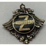 A WWI style zeppelin crew badge with markings to reverse.