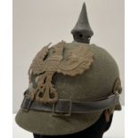 A WWI style Imperial German ersatz felt pickelhaube helmet.