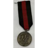 A WWII style German Sudetenland medal on ribbon.