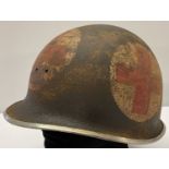 A WWII style semi relic US M1 front split seam swivel bale US medics helmet.