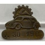 A German WWII style Volkswagen factory workers lapel badge.
