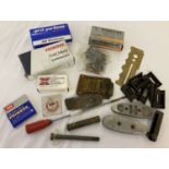A collection of military gun accessories and parts.