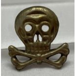 A WWI style 1st pattern Brunswick Feldmutze skull badge, with lugs to reverse.