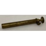 An antique brass powder measure c 1840.