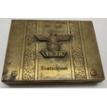 WWII style ornate German tin engraved "Alles Fur Deutschland" with brass spange to front.