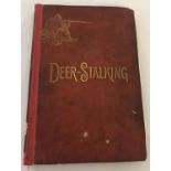 An 1886 first edition of "Deer-Stalking" by Augustus Grimble. Original cover front and back.