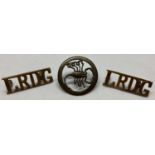 A WWII style long range desert group cap badge and shoulder titles.