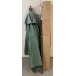 A boxed 2.1m green fabric garden parasol with tilt action, from Homebase.
