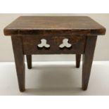 A small vintage mahogany stool with trefoil designs to side panels.