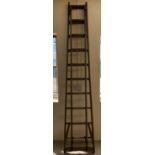 A large vintage wooden extending ladder from The Patent Safety Ladder Company.