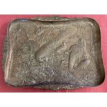 A vintage metal tray featuring Oriental birds, in relief. With floral shaped handles.