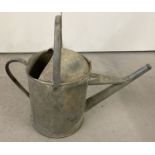 A vintage galvanised 2 gallon Beldray watering can.