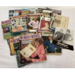 A quantity of assorted vintage knitting patterns together with 1980's Woman's Weekly magazines.