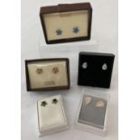 5 pairs of silver and white metal stud style earrings.