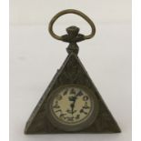 A small brass cased, triangular shaped pocket watch with Masonic style decoration.