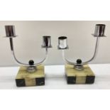 A pair of Art Deco marble and onyx based chromium plated double candle sticks.