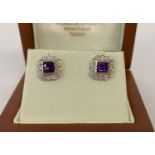 A pair of 9ct gold amethyst and diamond stud earrings by Luke Stockley.