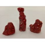 3 small carved coral Buddha figures.