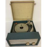 A vintage blue and white Fidelity portable record player.