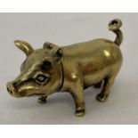 A small brass novelty vesta case in the form of a pig.