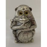 A white metal novelty vesta case in the form of a monkey.