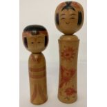 2 vintage wooden Japanese Kakashi dolls, both with signatures to underside.