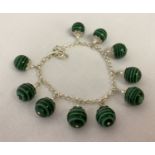 A white metal and malachite bracelet, clasp needs attention.