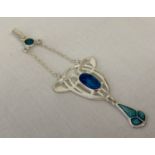 An enamelled white metal Art Nouveau style pendant, marked 'sterling' to reverse.