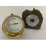 A brass cased ships barometer together with a freestanding "Daymaster" barometer set in slate.