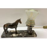 An Art Deco marble based bedside light with spelter horse figurine and period glass shade.