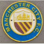 A painted "Manchester City" cast iron wall plaque.