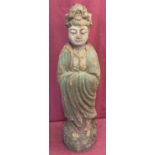 A large carved wooden figurine of an Oriental deity with painted detail.